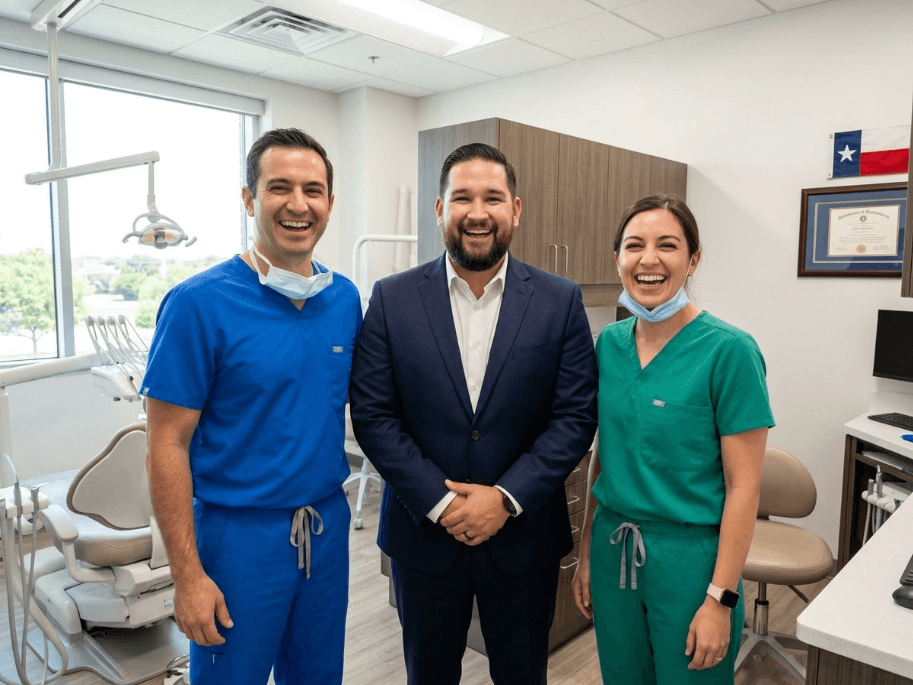 Ricardo M. with dental practice team